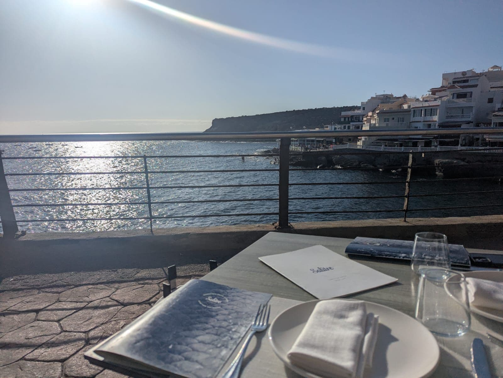 Restaurant table right by the sea