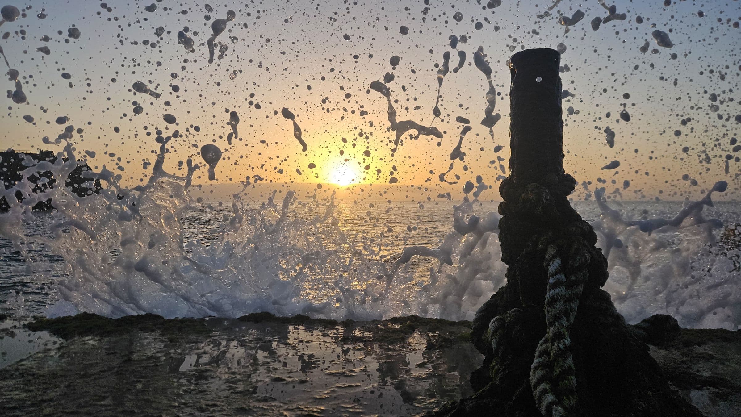 Surf on the coast at sunset