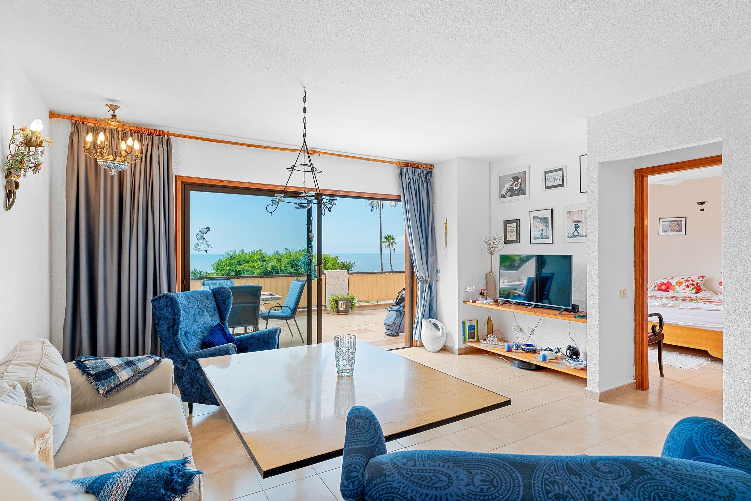 Living room with dining table and terrace access